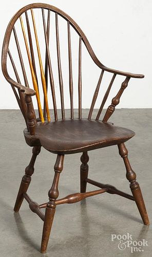 Braceback Windsor armchair, late 18th c., branded by the maker Ebenezer Tracy.