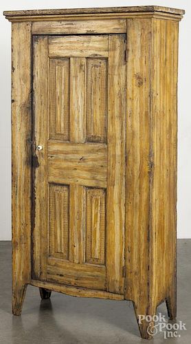 Painted pine wall cupboard, late 19th c., retaining an old ochre grained surface, 61'' h., 30 3/4'' w.