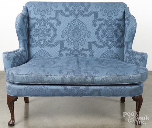 Queen Anne style mahogany loveseat.