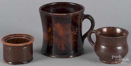 Two Pennsylvania redware mugs, together with a tub, signed James Albright 1867, tallest - 4 7/8''.