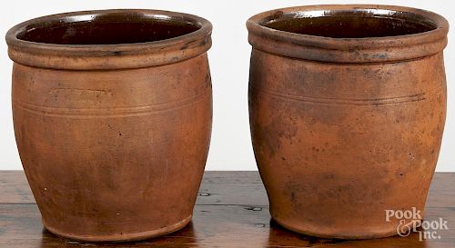 Pair of Pennsylvania redware crocks, 19th c., impressed John W. Bell Waynesboro, 8'' h.