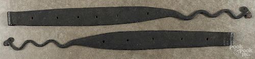 Pair of wrought iron strap hinges, late 18th c., with snake-form terminals, 31'' l. and 33'' l.