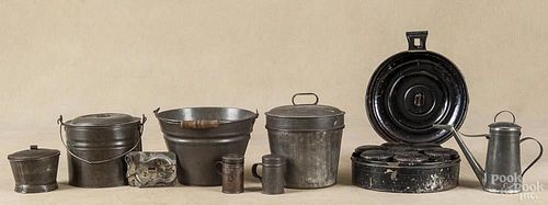 Group of early American tin, early 19th c., to include a lamp filler, shakers, a sugar bowl