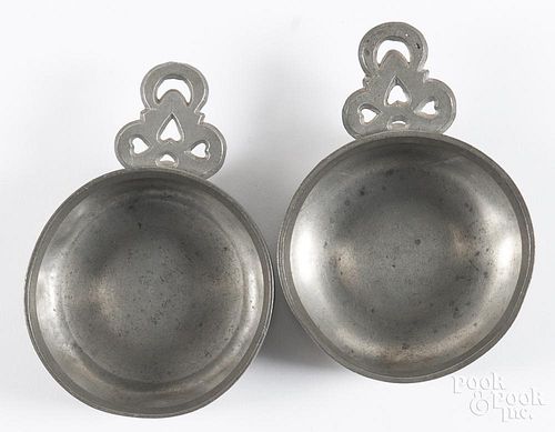 Pair of New England pewter porringer tasters, 19th c., stamped R on handle, 3 1/4'' dia.