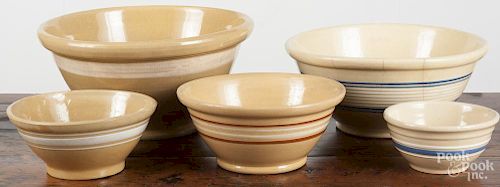 Five graduated yellowware bowls, largest - 7'' h., 13 3/4'' dia.