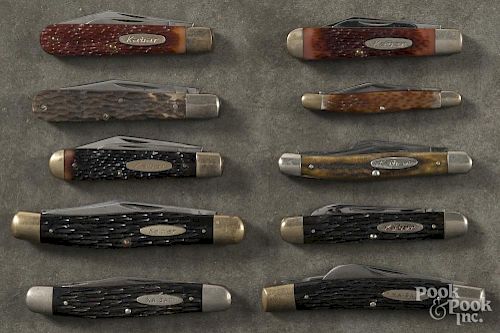 Ten Kabar pocket knives.