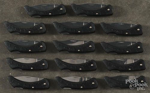 Fourteen Boker pocket knives.