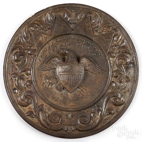 Cast iron eagle plaque, late 19th c., 15'' dia.