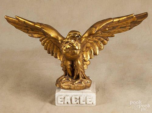 Gilt chalkware spread wing eagle, early 20th c., 12'' h., 26'' w., together with a marble base