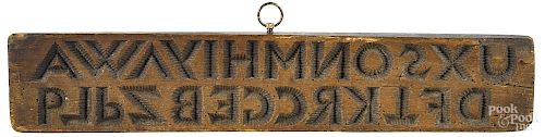 Carved alphabet cake board, 19th c., 4 3/4'' x 25''.