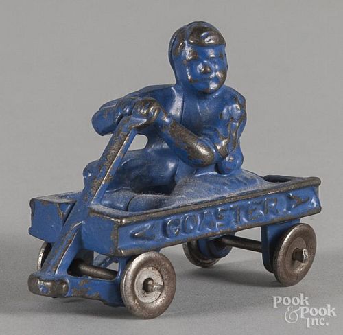 Hubley cast iron Coaster wagon with an integrated rider, 3 1/2'' l.