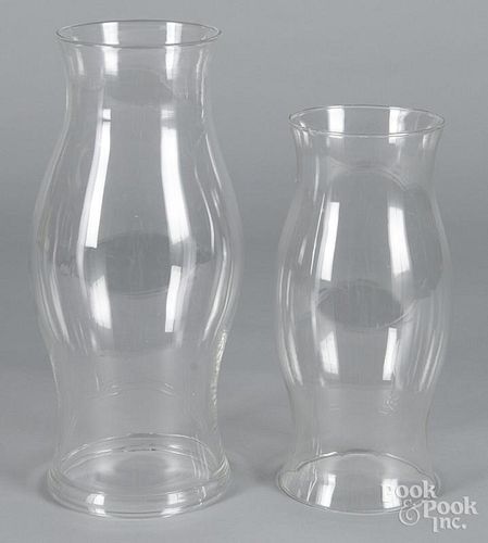 Two colorless glass hurricane shades, 11 1/4'' h. and 13 3/4'' h., together with a compote, 4 3/4'' h.