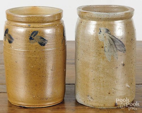 Two Pennsylvania stoneware jars, 19th c., with cobalt floral sprays, 8 3/4'' h. and 8 1/2'' h.
