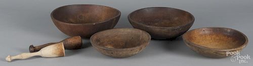 Four turned wood bowls, together with two mallets, largest - 4 1/2'' h., 15'' dia.