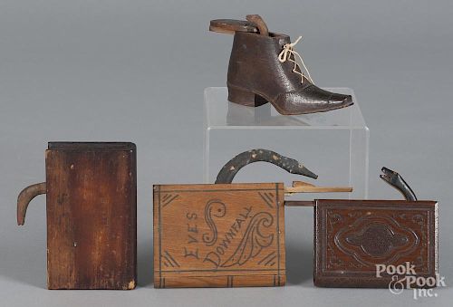 Four snake trick boxes, to include three book-form and one shoe-form examples, approximately - 3 1/4'' h.