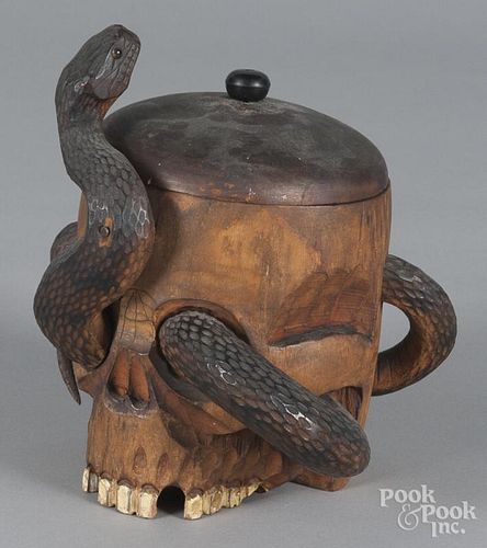 Carved wood snake in skull canister, early 20th c., 7'' h.
