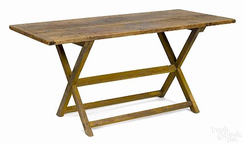 Pennsylvania painted pine sawbuck table, 19th c., the base with a later yellow surface, 27'' h.