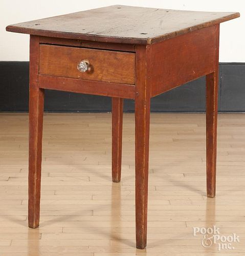 Stained pine work table, 19th c., retaining an old red surface, 30'' h., 23'' w., 34'' d.