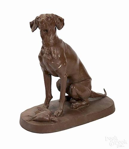 Pair of cast iron hound statues, 20th c., each on a slab base, 36'' h.