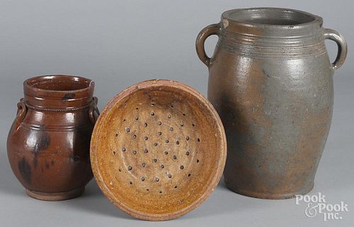 Redware crock, 19th c., with manganese splash decoration, together with a stoneware crock