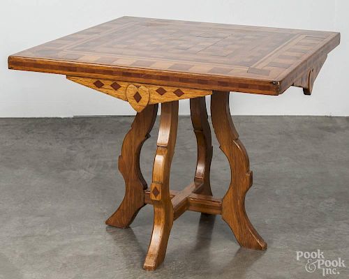Oak parquetry inlaid games table, ca. 1900, 24 1/2'' h., 30 1/2'' w.