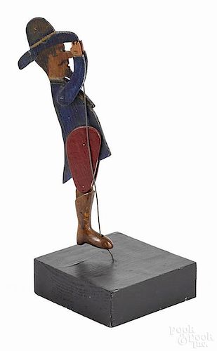 Carved and painted articulated man, early 20th c., on a wire, 10'' h.