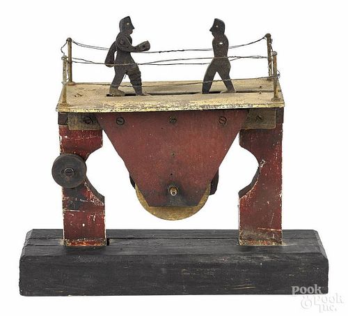 Mechanical painted wood boxing toy, early 20th c., with a wire ring, pulley driven, 11'' h., 12'' w.