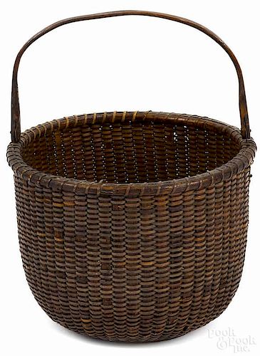 Nantucket lightship basket, 19th c., with a swing handle, probably made on the South Shoal Lightship
