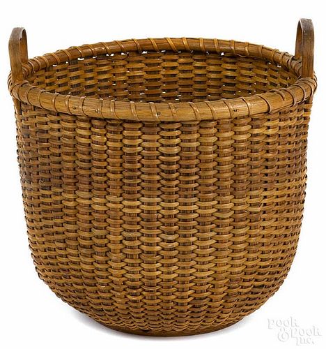 Nantucket half bushel basket with fixed heart form handles, early 20th c., attributed to Mitchy Ray