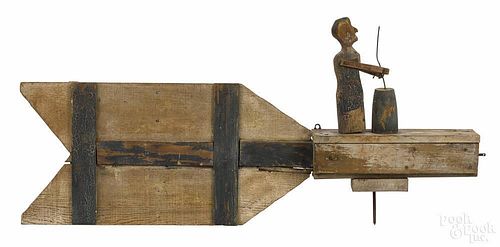Carved and painted whirligig of a woman churning butter, 19th c., 31 1/2'' l.