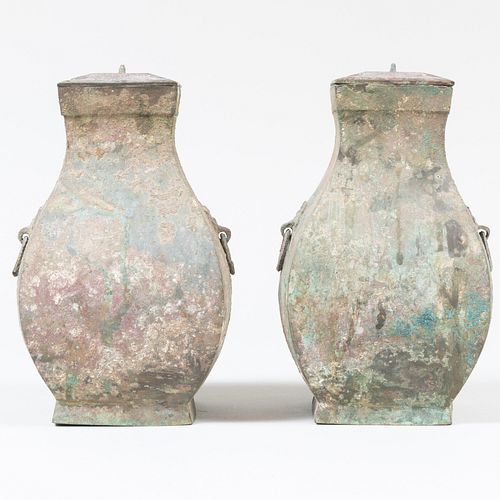 Pair of Chinese Bronze Faceted Hu Form Jars and Covers
