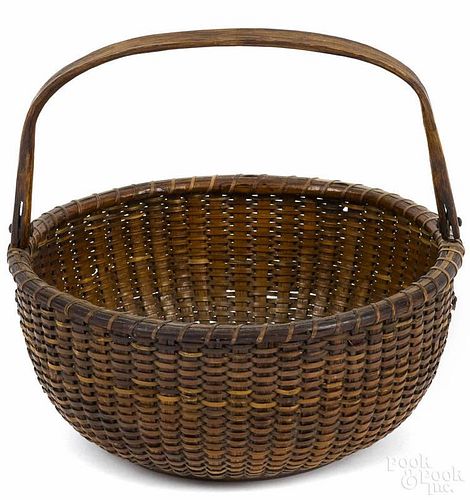 Nantucket lightship basket, 19th c., with a swing handle, probably made on the South Shoal Lightship