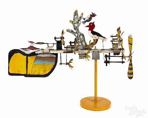 Painted tin whirligig of woodpeckers and sunflowers, early 20th c., 35 1/4'' l.