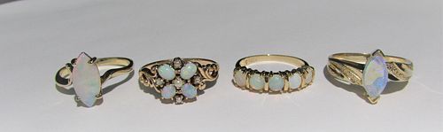 Four 14K gold genuine opal rings