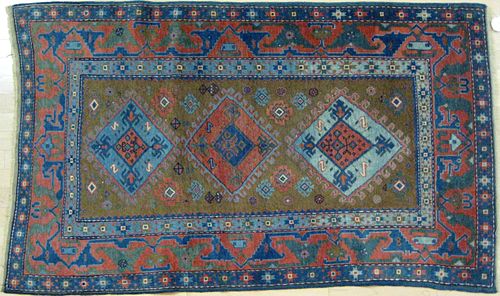 Caucasian carpet, early 20th c., with three medall