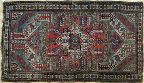 Kazak carpet, early 20th c., with central ivory me