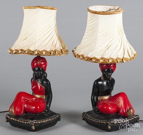 Three composition figural table lamps.