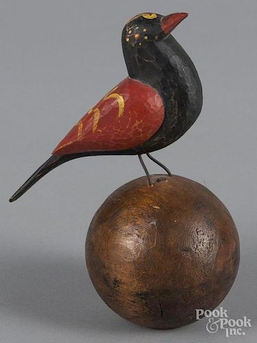 Carved and painted song bird on sphere, signed VP 1999, 6 3/4'' h.