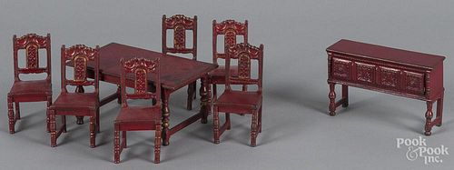 Eight pieces of Arcade red color doll house dining room furniture.