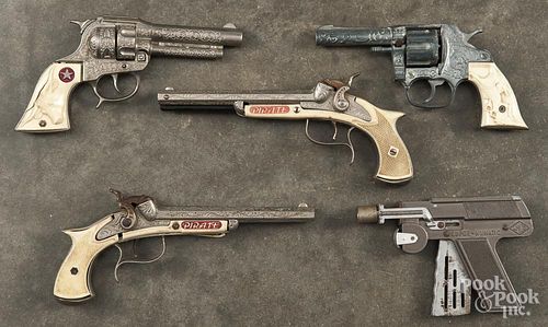 Five toy guns.