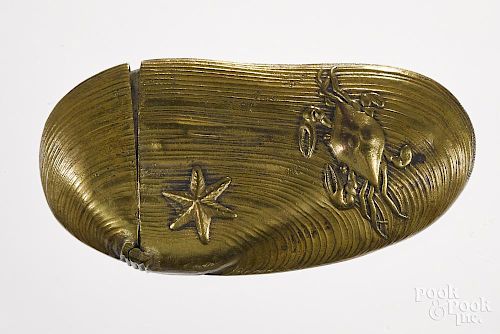 Embossed brass oyster match vesta safe with crab, starfish, shrimp, and shell decoration, 2 3/4'' l.