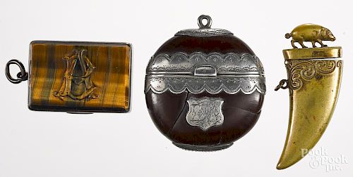 Three miscellaneous match vesta safes, to include a silver-mounted burra bean nut, 2 3/8'' h.