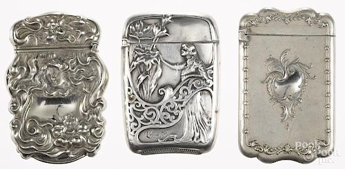 Two sterling art nouveau match vesta safes with embossed floral and woman decoration, 2 1/2'' h.