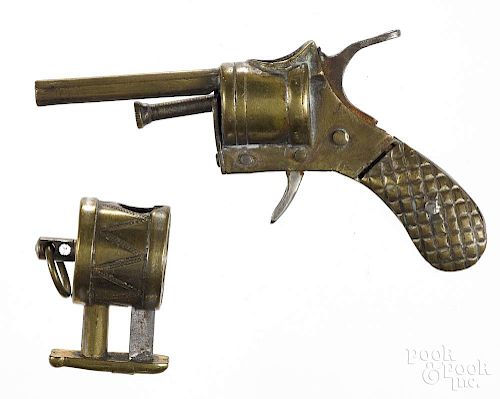 Brass figural revolver cigar cutter, 3'' l., together with a figural brass drum, inscribed Patent