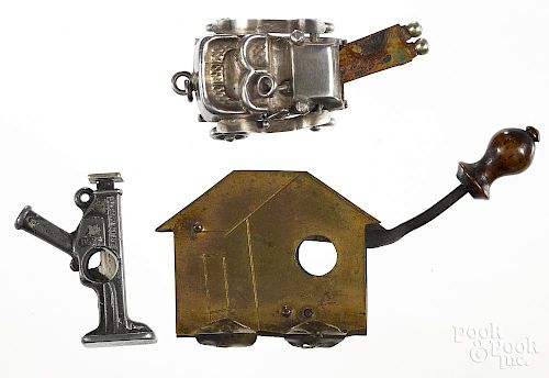 Three figural cigar cutters, to include a sterling silver car, a Duff floor jack