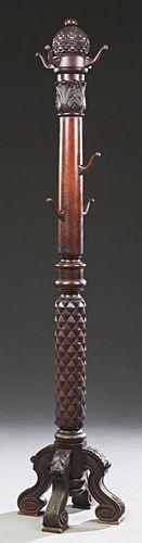 Carved Mahogany Costumer, 20th c., with an articho