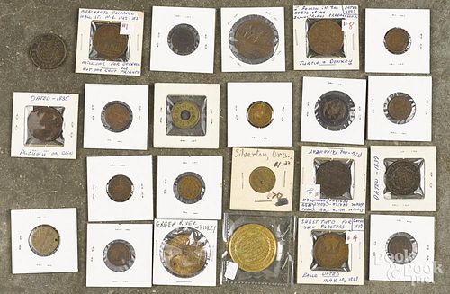 Seventeen Hard Times and Civil War tokens, 19th c., together with six assorted American tokens.