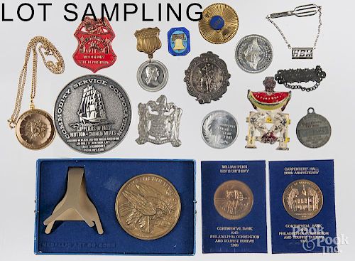 Assorted coins, medals, and souvenirs.