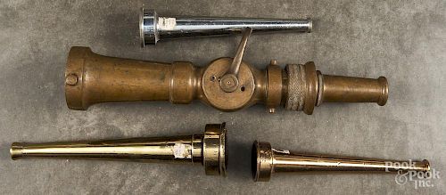 Three brass fire nozzles, to include one Larkin, 17 1/2'' l., together with a nickel-plated nozzle.