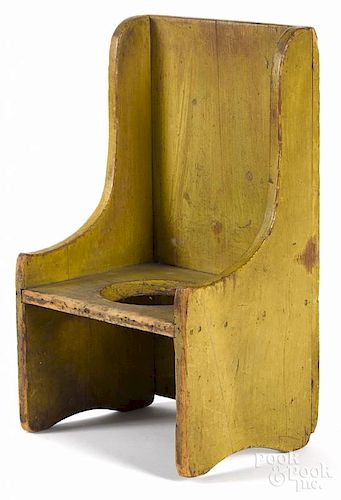 Painted pine doll's potty chair, 19th c., retaining an old yellow surface, 20'' h.